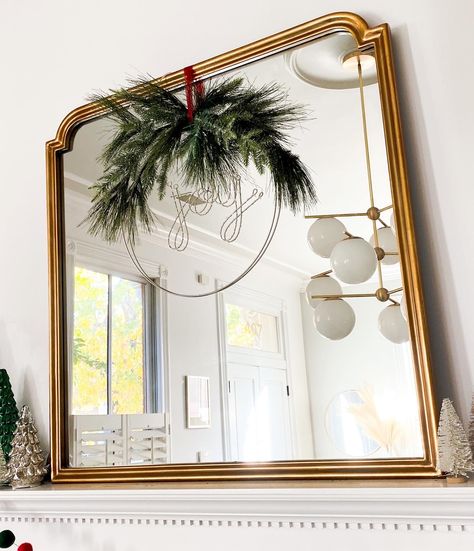 Mantle Mirror Christmas Decor, Mirror And Wreath Over Fireplace, Christmas Wreath Over Mirror, Mirror With Wreath Wall Decor, Christmas Garland On Round Mirror, Holiday Mirror Decor, Mirror Decor Christmas, Christmas Wreath On Mirror, Wreath Over Mirror