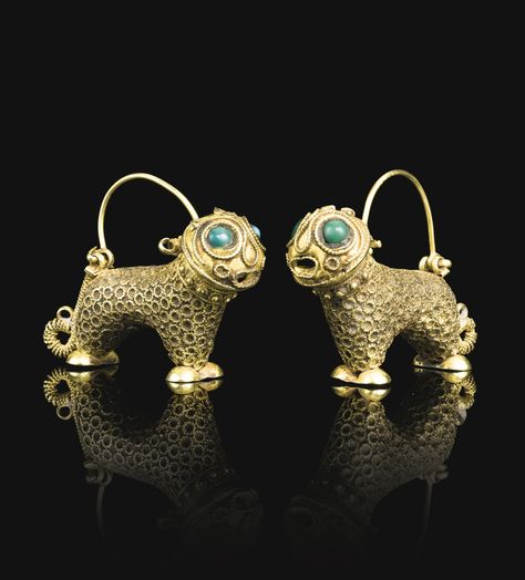 pair of lion-form gold earrings, Persia, 12th century each composed of gold, hammered and chased, designed as stylised lions decorated with twisted wire and inset green and turquoise stone eyes  Quantity: 2 2.5cm. height. 3.5cm. width. Ancient Jewels, Ancient Jewellery, Green And Turquoise, Historical Jewellery, Twisted Wire, Ancient Jewelry, Gold Jewelry Indian, Old Jewelry, 12th Century