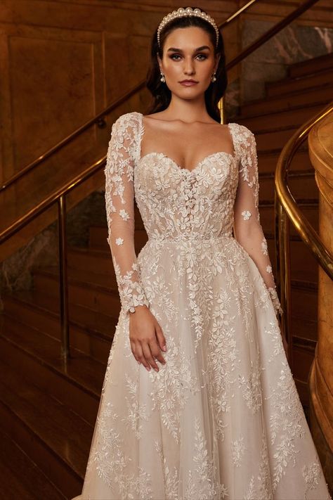 If you still cannot see yourself in a wedding dress, just wait until you meet this dreamy A-line gown. Inspired by all things regal, she’s designed with a modest, and romantic, sweetheart neckline, long sleeves and beaded lace that royalty would be eager to wear. When you’re walking down that aisle, you’ll never have felt more like a queen. Wedding Dresses A Line Long Sleeve, Engagement Gown, Calla Blanche, Bridal Reflections, Wedding Dresses Sweetheart Neckline, Wedding Dress With Pockets, Wedding Dresses Beaded, Dream Wedding Ideas Dresses, Long Sleeve Wedding