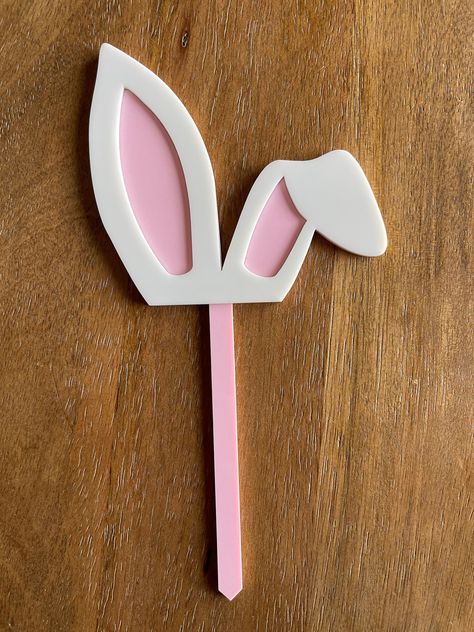 "This listing is for a layered acrylic bunny ear topper.  Cut from 1/8\" acrylic and layered with 1/6\" white acrylic. See drop down menu for sizes. Available in 3.25\" tall x 3.5\" wide and 4.5\" tall x 5\" wide. (Pick not included in those dimensions). See drop down menu for colors available. Perfect for Easter cakes, birthdays, and baby showers!" Easter Toppers, Easter Bunny Cake Topper, Bunny Cake Topper, Acrylic Bunny, Easter Cake Toppers, Glowforge Projects, Easter Bunny Cake, Easter Cake, Bunny Cake