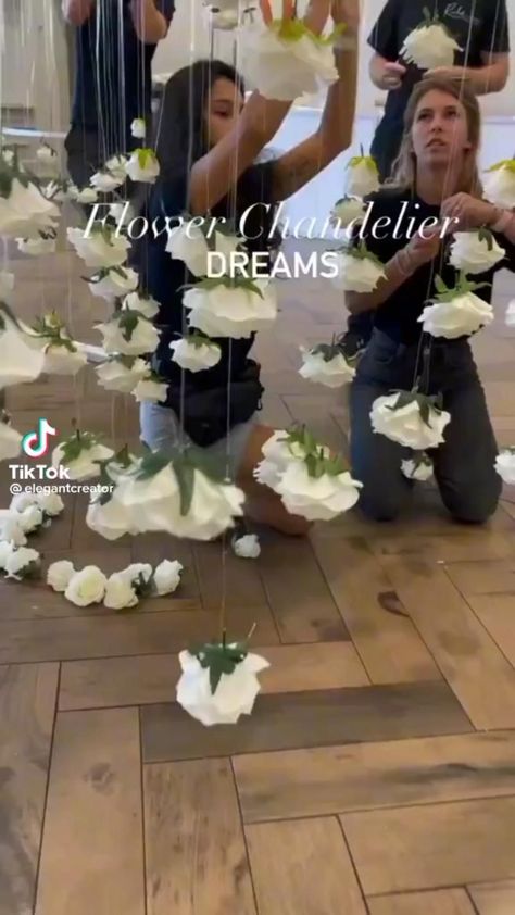 Twirl into a world of suspended blossoms, as your wedding unfolds in a blooming haven. Hanging Flowers Wedding, حفل توديع العزوبية, Tafel Decor, Flower Chandelier, Wedding Decor Style, Wedding Stage Decorations, Flower Arrangements Diy, Outdoor Wedding Decorations, Hanging Flowers