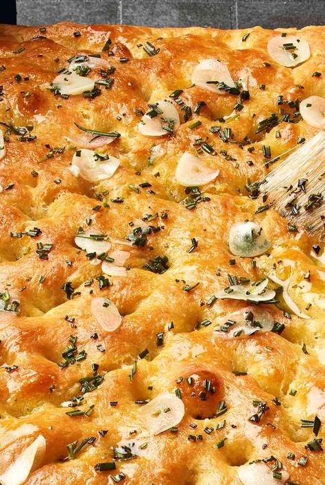 This easy garlic and rosemary focaccia recipe may spoil you on all other bread, ever. With no special tools required, only six ingredients, and about a half-hour of active time, it will become a new mainstay in your repertoire. A final brushing of garlic and rosemary infused olive oil takes this focaccia over-the-top. #bakinghacks #howtobake #howtocook #realsimple #recipeideas #recipes #focaccia Garlic And Rosemary Focaccia, Garlic Rosemary Focaccia, Veg Noodles Recipe, Veg Crispy, Chinese Side Dishes, Foccacia Recipe, Real Simple Recipes, Impressive Dinner, Rosemary Focaccia