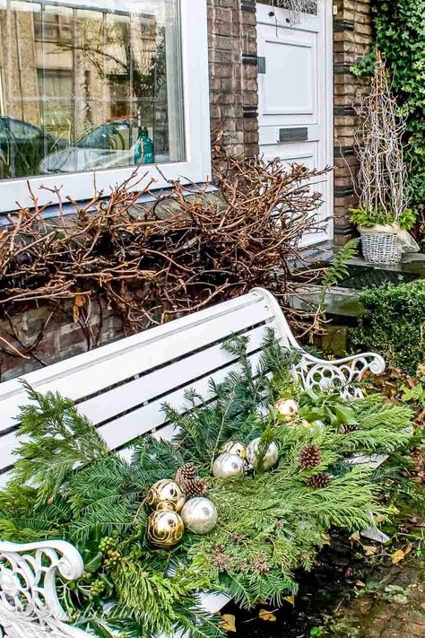 Bench Decorating Ideas Outdoor For Christmas, Outdoor Bench Holiday Decor, Christmas Front Porch Bench, Outdoor Bench Decorating Ideas Christmas, Christmas Front Porch With Bench, Decorating Outdoor Bench For Christmas, Christmas Bench Decorations Outdoor, Outdoor Bench Christmas Decorating Ideas, Simple Winter Porch Decor