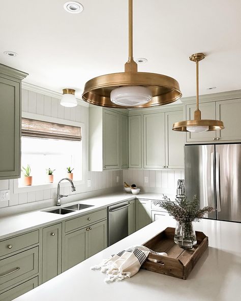 New on the blog: our top 7 green paint colors! If you’re looking for ways to incorporate green into your home or just seeking some Sunday inspiration - go check it out! Link in bio. . On the topic of green…here’s a Sneak Peek of this gorgeous Tangletown kitchen remodel! We’re loving how the soft green cabinetry color is working with the mixed metal finishes. Pairing these gorgeous framed cabinets with a timeless color like Benjamin Moore’s October Mist 1495 was a must. Add a little brass blin... October Mist Kitchen, October Mist Kitchen Cabinets, October Mist, Framed Cabinets, Benjamin Moore Green, Sunday Inspiration, House Redesign, Framed Cabinet, Green Paint Colors