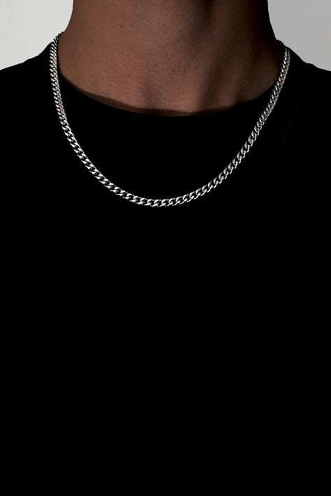 This is a photo of a 5mm Cuban Link Chain for Men, a streetwear fashion accessory made from stainless steel with a silver finish. Pictured: Silver necklace featuring a durable, stainless-steel chain with a unique cuban link design. It's an affordable accessory from our Etsy Shop that adds a stylish touch to any outfit. #CubanLinkChain #MensAccessory #5mmNecklace #StainlessSteel #Silver #Streetwear #FashionAccessory Street Wear Jewelry Men, Guy Chains, Silver Chain Men, Bf Gift, Silver Cuban Chain, Cuban Chain Men, Mens Chains, Streetwear Jewelry, Men Chain