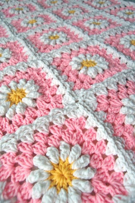 Pink Daisy Granny Square Crochet Blanket by tillie tulipYou can... Motifs Afghans, Baby Poncho, Crocheted Blanket, Crochet Granny Square Blanket, Crochet Daisy, Manta Crochet, Afghan Patterns, Crochet Afghans, Granny Squares Pattern