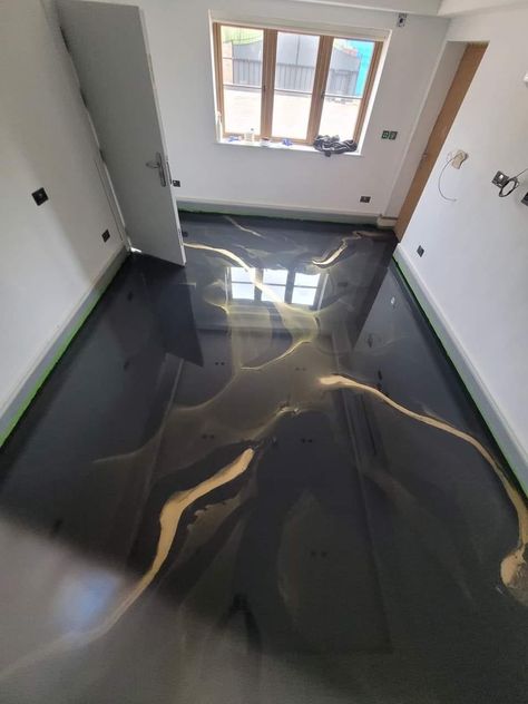 🖤 Mesmerizing Marbleized Metallic Black Epoxy floors with Gold veins, professionally installed for custom designs.🖤 Black White Gold Epoxy Floor, Black And White Epoxy Garage Floor, Black Marble Epoxy Floor, Matte Epoxy Floors In Home, Black And Gold Epoxy Floor, Poxy Floors, Apoxie Floors, Dark Epoxy Floor, Black Floor Ideas