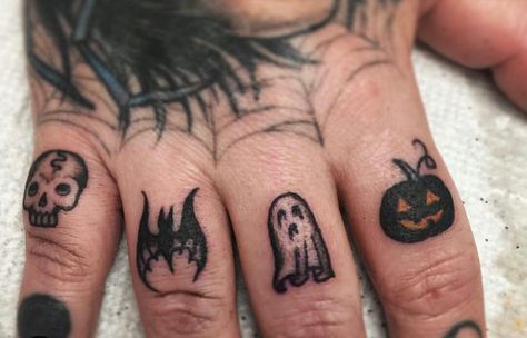 Halloween finger tatts Small Halloween Finger Tattoos, Awesome Finger Tattoos, Halloween Finger Tattoos For Women, Behind The Ear Halloween Tattoo, Bat Tattoo On Finger, Halloween Knuckle Tattoos, Hand Tattoos Halloween, Finger Tattoos Spooky, Finger Tattoos Halloween