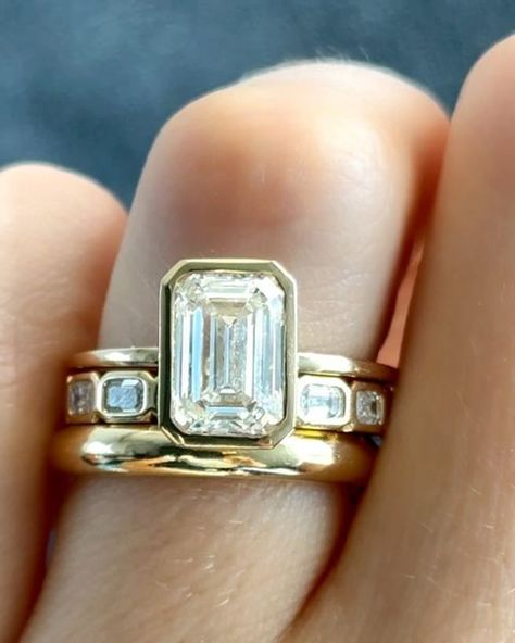 GOODSTONE on Instagram: "Our beloved Penumbra Bezel Set Engagement Ring💍 with an Emerald Cut seen two ways in: Yellow Gold and Blackened Rhodium. ✨Which style would you wear? Share this with someone who would love these rings💕  #engagementring #engagementrings #emeraldcutdiamond #emeraldcutdiamonds #emeraldring #bezelsetting #goodstone" Emerald Ring Bezel Set, Bezel Emerald Engagement Ring With Wedding Band, Bezel Wedding Ring Stack, Emerald Engagement Ring Bezel Set, Wedding Bands With Bezel Engagement Ring, Bezel Emerald Engagement Ring Stack, Emerald Bezel Engagement Ring With Band, Yellow Gold Wedding Ring Stack, Emerald Ring Set