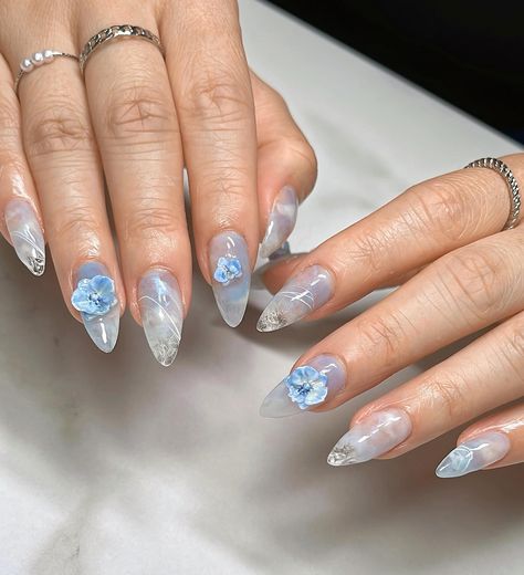 ☁️ Airy Orchids 🧊 Medium Almond Gel-X, client requested for a light blue palette with 3d orchids to match 💙 #gelxinspo #gelxnails #orchidnails #nailinspo #nailart #naildesign #almondnails #trendynails #pinterestnails #nails2inspire #3dnails #3dnailart #texturednails Blue Nail Inspo Aesthetic, 3d Flower Nails Blue, Tropical Blue Nails, Orchid Nail Designs, Light Blue Flower Nails, Blue 3d Nails, Light Blue Nails Acrylic, Light Blue Nails With Design, Light Blue Palette