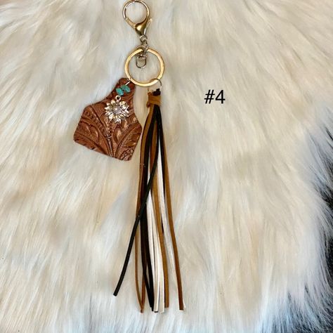 Brand New Make A Statement On The Run With The Leather Cow Tag Keychains. Stay On Trend With Our Brand New Western Cow Tag Teal Keychain! This Beautiful Accessory Features A Stamped Brown Cow Tag, Leather Tassels And A Sunflower Charm Sure To Draw Attention. The Classic Brown Tones Match Perfectly With Any Outfit And Add A Subtle Edge Of Style To Your Look. Add A Pop Of Fun While You Keep Your Things Organized. Get Wild With Our Western Cow Tag Keychain Today! -Brand New -Western -Cow Tag -Turqu Leather Cow Tag Keychain, Cow Tag Keychain, Pom Pom Purse, Cow Tag, Sunflower Charm, Western Brown, Brown Cow, Leather Credit Card Holder, Keychain Fob