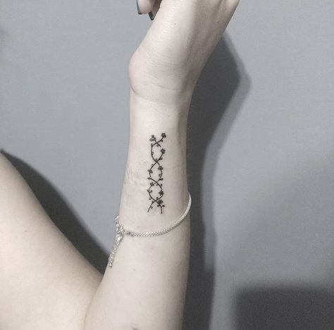 DNA | Tattoo by mmariahlui from IG Dna Tattoo Family, Dna Tatoos, Dna Flower Tattoo, Flower Dna Tattoo, Subtle Science Tattoos, Brca Gene Tattoo, Scientist Tattoo Ideas, Dainty Dna Tattoo, Fine Line Dna Tattoo