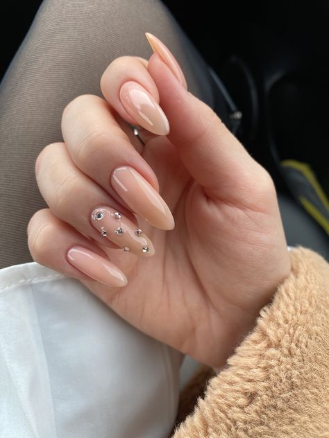 Minimalist Gem Nails, Almond Nails With Rhinestones Classy, Nude With Rhinestone Nails, Nude Nails Rhinestones, Nude Rhinestone Nails, Nails Gems Rhinestones, Nude Nails With Gems, Nude Nails With Diamonds, Nude Nails With Rhinestones