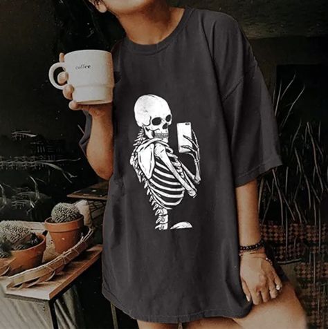 The best Halloween shirts feature skeletons, witches, references to movies like Hocus Pocus, and classic horror characters. #halloween #fashion Nurse Shirts, Vintage Skull, Short Sleeve Tops, Skull Print, Witch