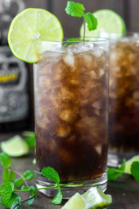 With warm spiced notes from Coca-Cola and dark rum and brightness from the lime and mint, this black mojito is a spin on a classic. #blackmojito #mojito #cocktail | chiselandfork.com Black Mojito, Vodka Sunrise, Peach Daiquiri, Cocktail Maker, Mojito Cocktail, Food Favorites, White Rum, Dark Rum, Spiced Rum