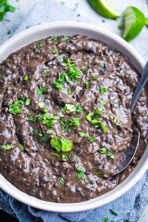 Super easy refried black beans recipe made with cooked or canned black beans, a few pantry ingredients, and a potato masher. Enjoy with your favorite Mexican food! Refries Black Beans Recipe, Refried Black Beans Recipe, Black Bean Refried Beans, Omnivore Recipes, Make Refried Beans, Refried Black Beans, Black Beans Recipe, Honduran Recipes, Mexican Favorites