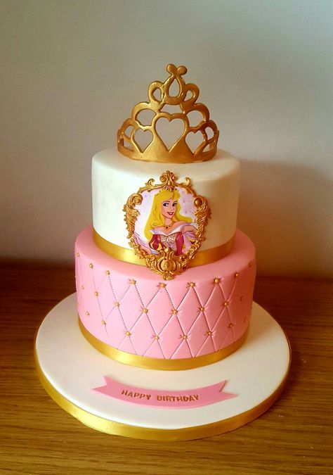 Princess Aurora cake with handmade gold crown Princess Aroura Cake, Princess Aurora Birthday Cake, Aurora Cake Sleeping Beauty, Aurora Cake Ideas, Aurora Party Ideas, Aurora Princess Cake, Princess Aurora Birthday Party, Aurora Birthday Cake, Aurora Birthday Party