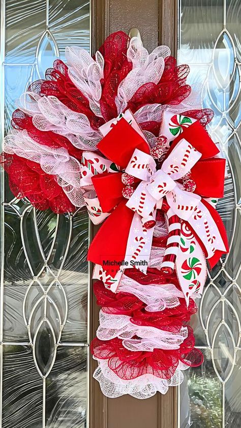 A beautiful large Dollar Tree Candy Cane Wreath tutorial, the base is made using my no fray Folded Ruffle method. The folded ruffle provides a textured base with little to no fraying. Let me show you how to make this deco mesh candy cane wreath. What a fun wreath for your front door this Christmas. Let's get started wreath making with my step by step tutorial! Mesh Wreath Tutorial Step By Step, Candy Cane Mesh Wreath Diy, Candy Cane Wreath With Mesh, Deco Mesh Candy Cane Wreath Tutorial, Candy Cane Shaped Wreath, Diy Candycane Wreaths, Candy Cane Deco Mesh Wreath, Mesh Candy Cane Wreath Tutorial, Deco Mesh Candy Cane Wreath