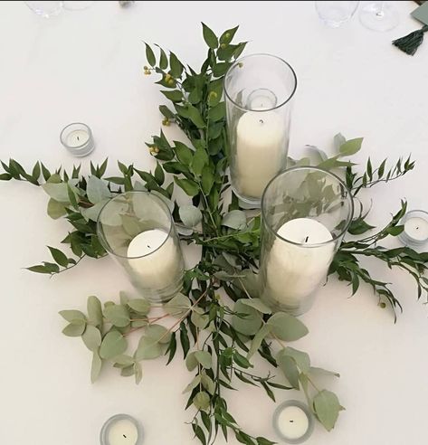 Cylinder vases with a simple bed of fresh ruscus and eucalyptus. Vases With Greenery, Vase With Eucalyptus, Botanical Wedding Decor, Eucalyptus Centerpiece, Botanical Center, Wedding Eucalyptus, Olive Wedding, Events Center, Pioneer School