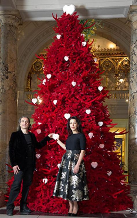 Helen and Colin David in front of the 'Red Velvet Tree of Love' V&A Christmas Tree, designed by Helen and Colin David, 2013. © Victoria and Albert Museum, London Over The Top Christmas Decor, Red Xmas Tree, Red Christmas Trees, Antler Tree, Velvet Tree, Amazing Christmas Trees, Turquoise Christmas, Holiday Deco, Velvet Christmas