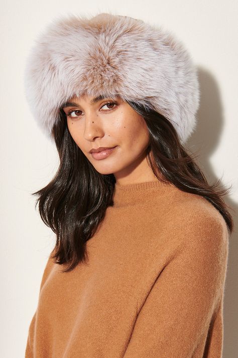 There isn't a more luxurious way to keep warm this winter. Slip on this silky mink hat for a lesson in elegance, and you won't ever take it off. Canadian sheared mink fur adorns the crown, while fluffy Finnish fox fur trim adds volume and pure decadence. The interior is comfy and warm, thanks to a soft, quilted polyester lining. Fur Hat Outfit, Cossack Hat, Hats Cowboy, Mink Coats, Fur Keychain, Dinner Wear, Fur Hats, Faux Fur Hat, Fur Accessories