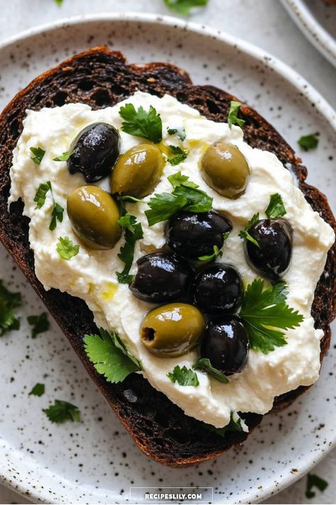 I just made this mouthwatering olive and ricotta toast! The combination of creamy ricotta, savory olives, and fresh cilantro on crispy rye bread is irresistible. Perfect for a quick snack or a light lunch, this recipe is as easy to prepare as it is tasty. Can't wait for you to try it! Cheesy Olive Bread, Olive Bread Recipe, Ricotta Toast, Gourmet Appetizers, Olive Bread, Gourmet Treats, Quick Snack, Cheesy Recipes, Rye Bread