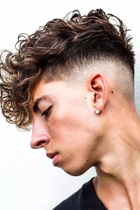 Check out our gallery of modern ideas for a faux hawk haircut. Here you’ll find a short curly high and tight with a beard, a medium messy fohawk with a fade, a long black hawk with a tapered back and many more. #menshaircuts #menshairstyles #fauxhawkhaircut #fauxhawk #fohawk Modern Perm, Faux Hawk Men, Fohawk Haircut, Curly Hairstyles For Men, Mens Hairstyles Curly, Edgars Haircut, Drop Fade, Curly Undercut, Undercut Styles