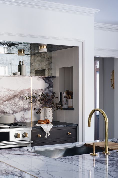 Kitchen island design idea. Lilac marble stone slab backsplash with mirrored glass accent and brass inlay, unfinished brass sink faucet in island. Island counter has marble stone slab countertop. Historic Home Interiors, Jean Stoffer Design, Jean Stoffer, Ann Sacks Tiles, Warm Kitchen, Garage Interior, Inside Design, Kitchen Marble, Historic Home