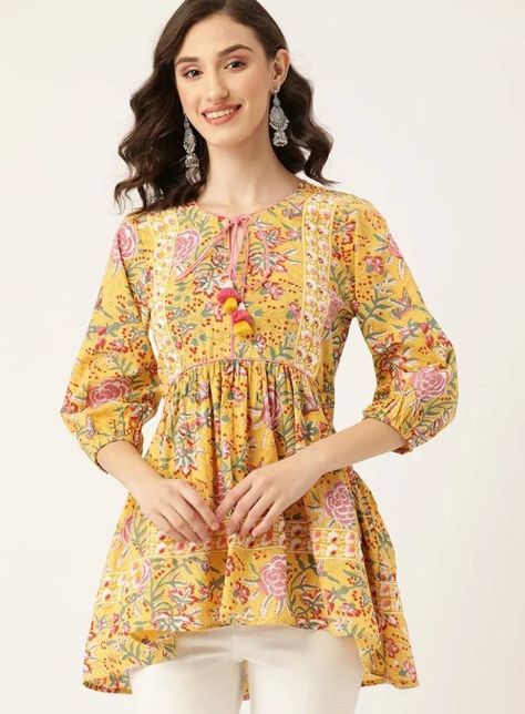 Product Details * Yellow and pink regular a-line top * Ethnic motifs print * Tie-up neck, three-quarter, puff sleeve sleeves * Gathered or pleated detail * Woven * Tie-ups closure Material & Care 100% Cotton Hand Wash Package Includes : 1 Kurti Check the size chart in the photo section to choose a perfect size IMPORTANT :- kindly provide your Mobile No. when ever you make payment because its mandatory for standard shipping services to ship article. Please contact me if you have any queries. Short Kurtis For Jeans Indian, Puff Sleeves Kurti, Short Kurtis For Jeans, Anarkali Dress Indian, Jaipuri Print, Kurti Top, Ethnic Motifs, Short Kurti, Top Indian