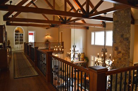 Upstairs walkway with hardwood floors, double the width for furniture, built-ins and views of main level, exposed beams and 40ft. fireplace. Upstairs Looking Down Into Living Room, Exposed Beams, River House, Rustic Living Room, Built Ins, Walkway, Beams, Hardwood Floors, Fireplace