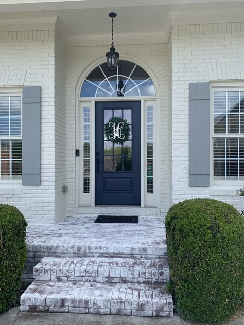 Brick - BM ballet white Shutters - SW Stamped Concrete Door - SW Charcoal Blue Lime washed brick patio White Brick House With Blue Accents, White Brick Blue Door, White Brick Blue Shutters, White Brick House Blue Shutters, Blue Shutters Brick House, Brick House Blue Shutters, White Brick House With Shutters, Painted Exterior House, Shudder Ideas