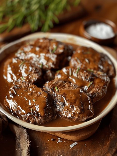 Give this nostalgic, budget-friendly Amish dinner a try for the ultimate in down-home, gravy-licious comfort food satisfaction. Simple ingredients, maximum flavor! Ingredients: Instructions: In a bowl, mix together the ground beef, milk, cracker crumbs, salt, pepper, and finely chopped onion until well combined. Form the beef mixture into a loaf shape and place it on […] Amish Steak And Gravy, Amish Poor Man’s Steak, Poor Man’s Steak, Poormans Steak, Poor Mans Steak Ground Beef, Hamburger Steak Recipes, Hamburger Recipes Patty, Poor Man, Hamburger Recipes