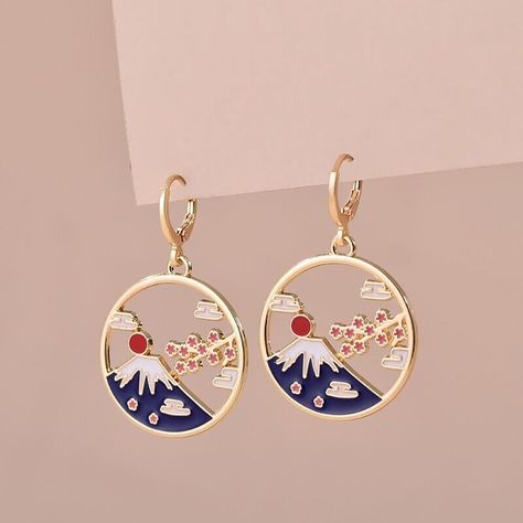 Japanese style folklore inspired enamel earrings Materials Zinc alloy & Enamel Approximate measurements 10mm hoop with hinged fastening 4.3 cm in length 2.8 cm diameter Pretty enamel gold tone earrings inspired by Japanese folklore & culture This design is inspired by Mount Fuji Mount Fuji was said in traditional Japanese folklore to have been created in a day witnessed by a woodsman called Visu Brand new - sent in reusable mini plastic box to protect the earrings. If you require a backing card & cellophane sleeve for a gift please leave a note at checkout so we can make sure you have those Thank you for your interest. Please visit our store Kawaii Rainbows for lots more quality Japan & Korea inspired & LGBTQ gifts & jewellery Terms * All orders are dispatched within one working day * The Lgbtq Gifts, Japan Gifts, Japanese Jewelry, Japanese Folklore, Backing Card, Mount Fuji, Enamel Earrings, Gold Enamel, Traditional Japanese