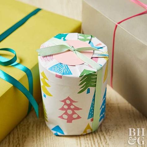 This easy gift idea is the perfect stocking stuffer or small present. Plus, we'll show you how to make handmade wrapping paper. #diygifts #christmas How To Wrap A Candle Gift, Wrapping A Candle, How To Wrap A Candle, Diy Stamped Wrapping Paper, Wrap A Candle, Stamped Wrapping Paper, Gift Wrapping Candles, Christmas Present Wrap, Easy Gift Idea