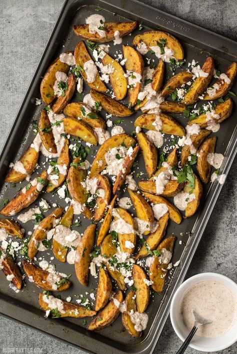 These simple Roasted Potato Wedges are the perfect vehicle for this creamy, garlicky shawarma sauce and crumbled feta. #garlic #potatoes #sidedish #carbs #easyrecipes #recipe Shawarma Sauce, Easy Roasted Potatoes, Roasted Potato Wedges, Roasted Potato, Creamy Mushroom Pasta, Budget Bytes, Potato Wedges, Creamy Garlic, Veggie Sides