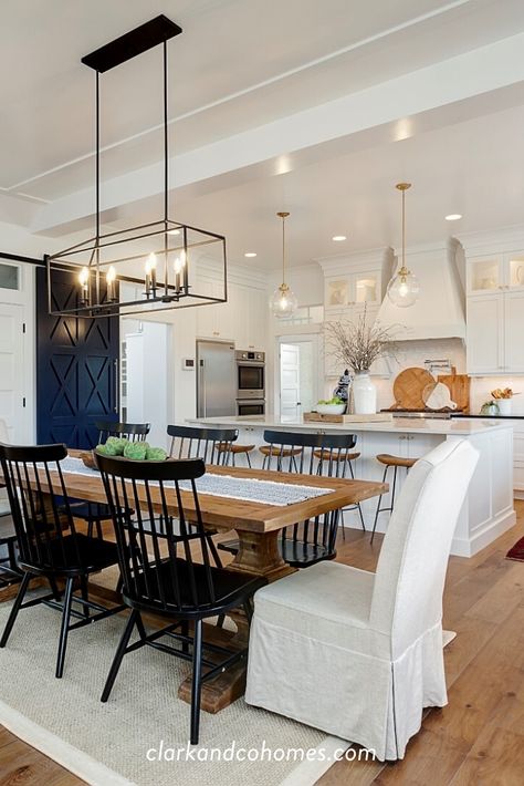 The dining room connects seamlessly to the kitchen in this custom modern farmhouse designed and built by Clark & Co. Homes in Boise, Idaho. A custom X-design barn door hides the butlers pantry from view while adding decorative elements to the open concept space. #customhome #diningroomdecor #kitcheninspiration Farmhouse Dining Room Lighting, Open Concept Kitchen Living Room, Modern Farmhouse Dining Room, Modern Farmhouse Dining, Open Dining Room, Modern Kitchen Design Open Concept, Boise Idaho, Open Concept Kitchen, Dining Room Inspiration