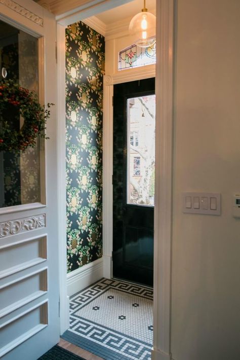 Vintage panels in the transoms above the windows were restored by The Stained Glass Store in Park Slope. Another, with a house number, was newly made for the space above the entry door. Floral wallpaper in the entry vestibule came from Rifle Paper Co. Heather Strommen, Brownstone Interiors, Entryway Tile, Entry Tile, Small Entrance, Glass Store, Entry Hallway, Row House, Entry Foyer