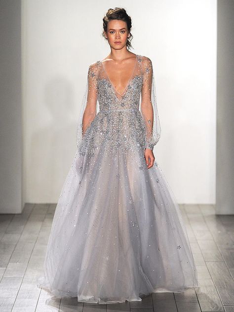 Deck out a dusty blue wedding dress by Hailey Page with celestial beading along the long sleeves and plunging neckline for an ethereal bridal look. Ice Blue Wedding Dress, Baby Blue Wedding Dresses, Blue Bridal Dress, Blue Wedding Gowns, Baby Blue Weddings, Blue Wedding Dress, Ethereal Wedding Dress, Hayley Paige Wedding Dress, Beaded Wedding Gowns