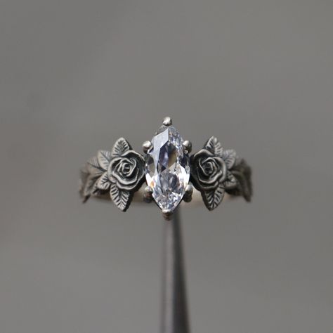 Moissanite Rose Leaf 925 Silver Marquise Ring, Flower Moissanite Ring, Colorless Stone Silver Ring, Alternative Moissanite Engagement Ring -->Ring details: - Theme: Romantic Wedding, Engagement, Daily, Frienship - Comfortable Band - Center Stone : Onyx - Ruby - Amethyst - Citrine - Moissanite - Emerald - Carat: 5x10 mm --->Materials: - 925 Silver or Gold Plated Silver --->The ring size on the model is 6 US. --->Items are shown larger in pictures to show detail - please note the dimensions. This item is in my shop are handcrafted made to order. --->Accessories: - beautiful jewelry boxes, and some of little gifts. --->Guaranteed Purchase: - 14 Day Refund Guarantee; - Excellent Customer Service; - Free Transportation and insurance to All Parts Of The World; - Free Gift Box&Packing --->Please Rose Leaf, Cute Engagement Rings, Marquise Ring, Ring Flower, Gothic Rings, Dream Engagement Rings, Silver Wedding Rings, Silver Engagement Rings, Pretty Rings