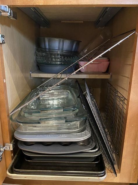 While I have a larger kitchen, my baking cabinet that houses all my baking pans is small. Follow along and see how I did my baking cabinet organization in this small 24 inches wide cabinet in my kitchen. BEFORE CABINET: The stuff did not fit in the cabinet at all, and I had reduced it as much as possible. I used all these items and had items from my oven and microwave in here as well. It was super frustrating to go into this cabinet, as you can see. First, I cleared out the entire… Baking Cabinet Organization, Baking Sheet Storage, Baking Pans Storage, Baking Pans Organization, Baking Sheets Organization, Baking Cabinet, Baking Organization, Dish Cabinet, Wide Cabinet