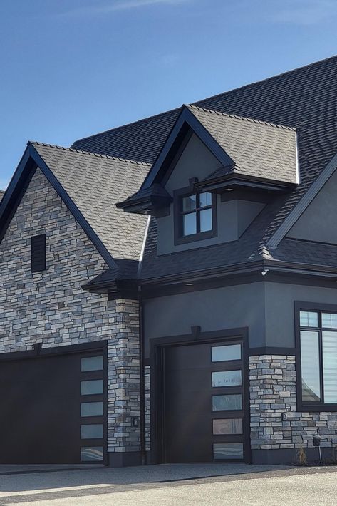 Dark colored house, light colored stone, need we say more? 🥳 This is a home that’s definitely making people’s jaws drop as they walk by, because ours sure did! 😱 Our manufactured stone veneer is making this home a showstopper with the added texture and color! 😉 Stone Exterior Houses, Manufactured Stone Veneer, House Light, Cultured Stone, Manufactured Stone, Colored Stone, Stone Veneer, Door Trims, Stone Texture