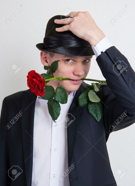 Man With Roses In Hand, Guy Holding Flowers, Rose In Hand, Image Reference, Holding Flowers, Funny Dude, Art Poses, Black Suits, Man Humor