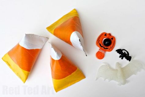 Easy Candy Corn Craft - turn TP Rolls into pyramid candy corn treat boxes perfect for Halloween and Thanks Giving Halloween Diy Candy Gifts, Candy Corn Toilet Paper Roll, Creative Ways To Give Out Halloween Candy, Halloween Candy Box Ideas Diy, Candy Corn Candles Diy, Candy Corn Craft, Childcare Crafts, Halloween Container, Halloween Toilet Paper