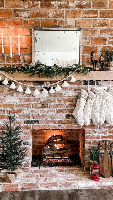 thesimplydistressed on Instagram: It’s a sit by the fire and eat ice cream kind of night. Not too sure if that’s crazy or brilliant. But at least our bellies will be happy.… Christmas Mantle No Garland, Red Brick Fireplace Christmas Decor, Minimal Christmas Mantle, Brick Fireplace Christmas Decor, Christmas Hearth Decor, Christmas Mantels Rustic, Simple Christmas Mantle, Christmas Mantel Decorations Fireplaces, Mantal Decor