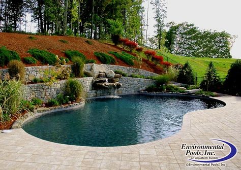 Free Form Pool Built Into Hill with Artistic Paver Decking www ... Pool Built Into Hill, Hillside Pool, Hills Pictures, Backyard Decorations, Swimming Pool Photos, Pool Design Ideas, Swimming Pool Construction, Swimming Pool Ideas, Sloped Backyard