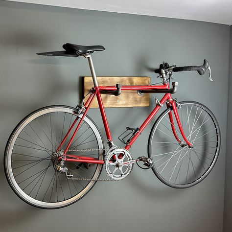 Ride in, relax, and let your bike cosy up. Your wall's new favourite art piece. Size available for all types of bikes and bars. No more unwanted wall scuffs and marks. Handmade in our Sussex workshop using 100% renewably sourced timber. Bike Display, Bike Rack Wall, Wooden Bicycle, Cyclist Gifts, Wooden Bike, Natural Wood Texture, Bicycle Storage, Bicycle Rack, Push Bikes