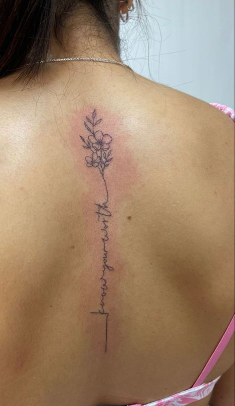 Spine Tattoos For Women With Words, Flower Script Spine Tattoo, Bible Verse Spin Tattoo, Small Spine Tattoos For Women Flowers, Cursive Tattoo With Flower, Know Your Worth Spine Tattoo, Simple Spine Flower Tattoo, Word And Flower Spine Tattoo, Find Someone Who Grows Flowers Spine Tattoo