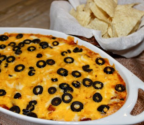 Hot Layered Mexican Dip with layers of refried beans, chili and cheese, baked and served warm with chips for dipping Warm Taco Dip, Mexican Apps, Cheese Bean Dip, Layered Mexican Dip, Taco Dips, Cream Cheese Bean Dip, Hot Taco Dip, Mexican Bean Dip, Mexican Dip Recipes