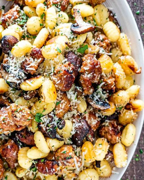 This Mushroom Sausage Sheet Pan Gnocchi is loaded with crispy gnocchi, delicious sausage and lots of mushrooms all baked in one sheet pan! #gnocchi #sheetpandinner #mushrooms #sausage #recipe Mushroom Sheet Pan Dinner, Crispy Gnocchi, Mushroom Sausage, Sausage Sheet Pan, Sheet Pan Gnocchi, Light Pasta Dishes, Easy Delicious Dinner Recipes, Easy Delicious Dinners, Light Dinner Recipes