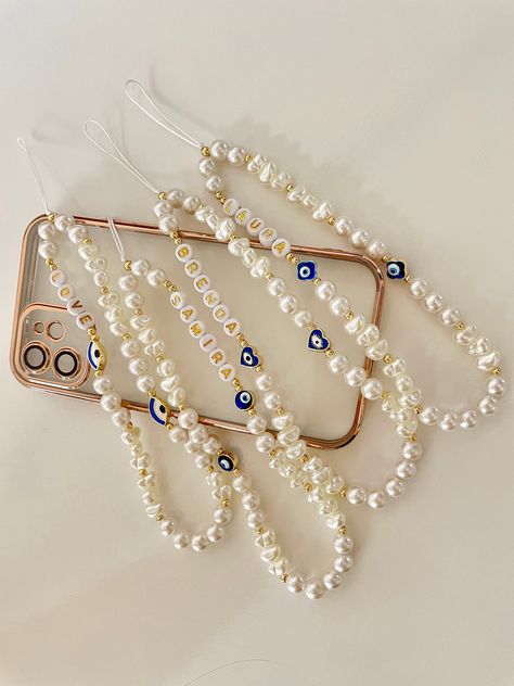 To buy the second one for free, please apply the coupon code: BUY2GET1FREE at checkout. -PRODUCT FEATURES- These super cute and stylish custom phone charms are hand made with evil eye beads and artificial pearls. Length: 15cm + 5cm hoop -Multi-purpose Usage- You can use these beaded phone charms for your phone, cameras, keys, light- weight electronic accessories, handbags and other items. -Perfect Gift- These phone straps are nice gift choices for friends, lovers, mothers, girlfriends and wives, especially on Valentine's Day, Mother's Day, birthdays, Thanksgiving, Christmas or New year etc. they will be very happy to receive such exquisite gifts. -HOW TO ORDER- 1- Select evil eye shape from the first drop down menu. 2- Add your name / word you would like to be written on the charm. -PACKAG Phone Charms Strap, Pearl Phone Charm, Beaded Phone Charms, Sunday School Crafts For Kids, Preppy Jewelry, Phone Straps, Pearls Diy, Phone Charms, Beads Bracelet Design